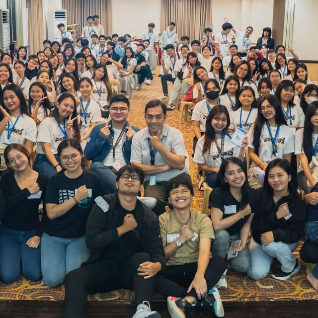 Mentoring & Coaching · students gathered at a campus gathering